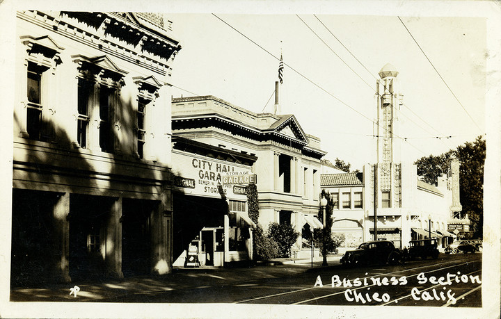 The Municipal building is just right of center.  The City Hall garage and the fire station, north along Main have been torn down and replaced by the city council building.  The tower of the Senator Theater building on the southeast corner can be seen in the background.